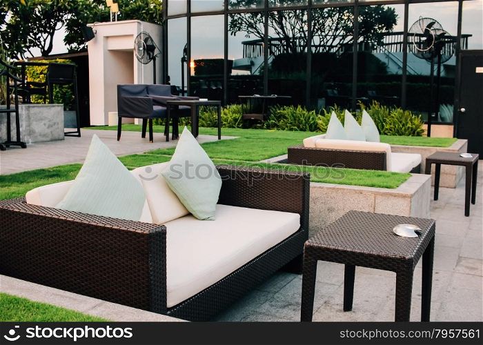 BANGKOK, THAILAND, JULY 25, 2015: Restaurant couch bar with view of Bangkok Cityscape at the Three Sixty Lounge of Millennium Hilton Bangkok Hotel in Bangkok, Thailand.