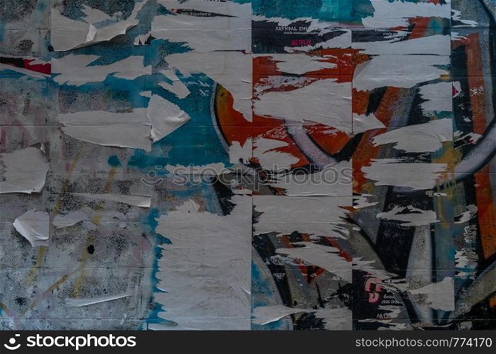 bangkok,Thailand - jun 29, 2019 : Colorful torn posters on grunge old walls as creative and abstract background, Background Or Texture With Copy Space, Toned Image.