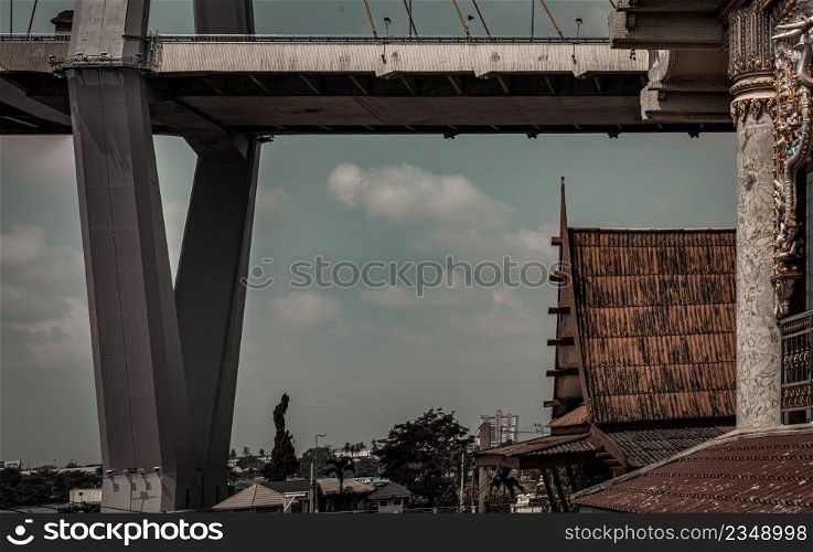 Bangkok, Thailand. Mar - 12, 2022   Beautiful view of Buddhist thai temple with suspension bridge can coexist perfectly. No focus, specifically.