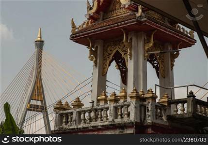 Bangkok, Thailand. Mar - 12, 2022   Beautiful view of Buddhist thai temple with suspension bridge can coexist perfectly. No focus, specifically.