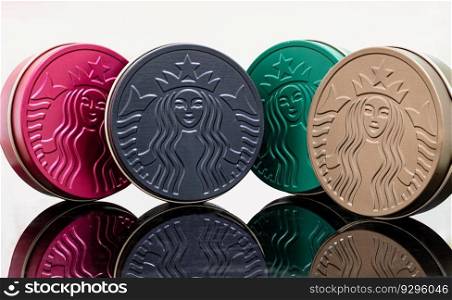 Bangkok, Thailand May 5, 2023 - The Colorful of Metal round boxes, which are the Collection Series of Starbucks. They are for keeping snacks or some accessories which are reflected on white background. Space for text.