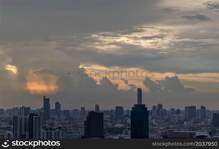 Bangkok, Thailand - Mey18, 2021 : Gorgeous panorama scenic of the sunrise or sunset with cloud on the orange and blue sky over large metropolitan city in Bangkok. Copy space, No focus, specifically.