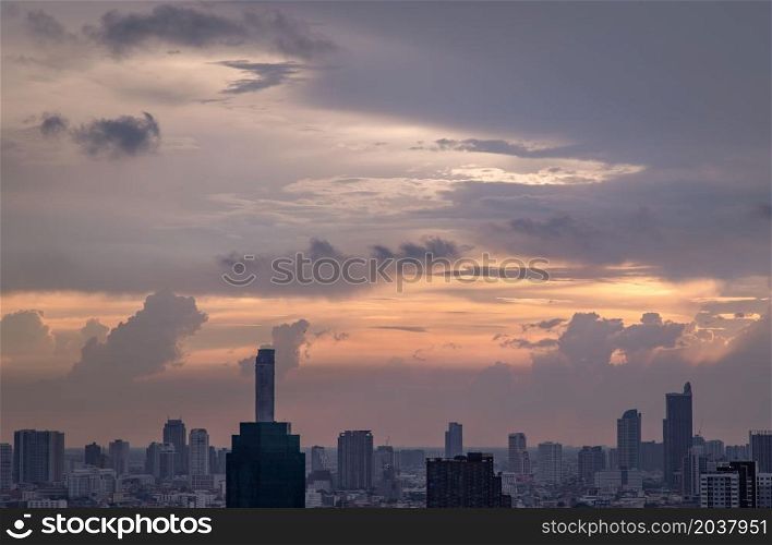 Bangkok, Thailand - Mey18, 2021 : Gorgeous panorama scenic of the sunrise or sunset with cloud on the orange and blue sky over large metropolitan city in Bangkok. Copy space, No focus, specifically.