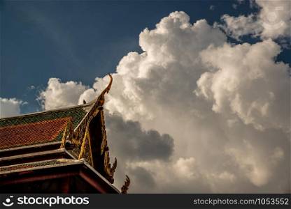 Bangkok, Thailand Oct 27, 2019 : The roof of the Thai temple, along with the gable at the top of the temple roof that receives on beautiful sun.
