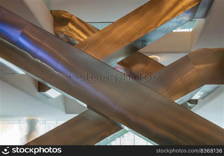 Bangkok, Thailand - Sep 30, 2022   Interior side view of complexity multiple modern escalators  Crisscross escalators . Modern architecture of large business conference center, Selective focus.