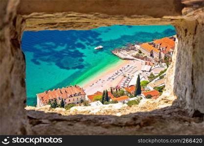 Banje beach in Dubrovnik aerial view through stone window, Dalmatia region of Croatia