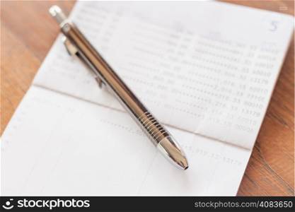 Bank account passbook with pen, stock photo