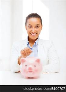 banking and finances concept - picture of lovely woman with piggy bank and cash money