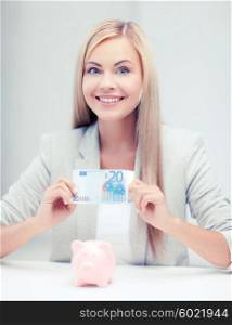banking and finances concept - picture of lovely woman with piggy bank and cash money. woman with piggy bank and cash money