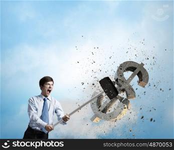 Banking concept. Young businessman crashing with hammer stone dollar symbol