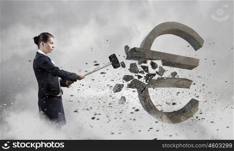 Banking concept. Young businesswoman crashing with hammer stone euro symbol