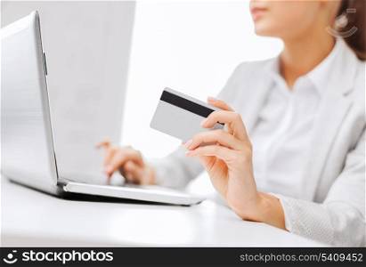 banking, shopping, money concept - businesswoman with laptop and credit card