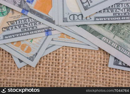 Banknote of US dollar placed on a linen canvas