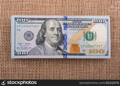 Banknotes of US dollar on canvas. Banknotes of US dollars on canvas on a linen canvas