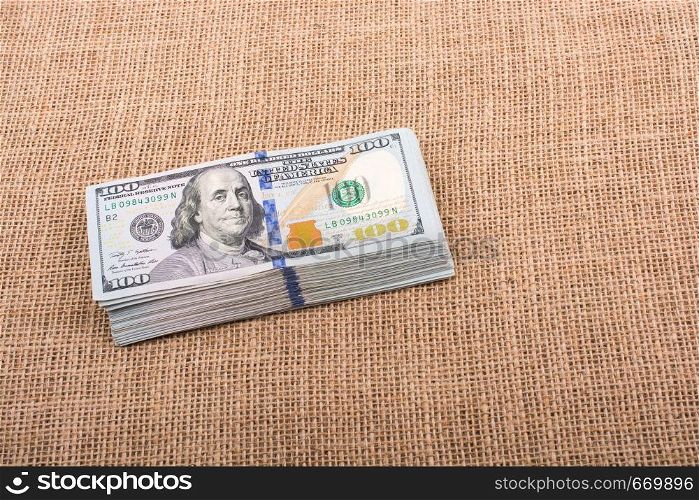 Banknotes of US dollars on canvas on a linen canvas