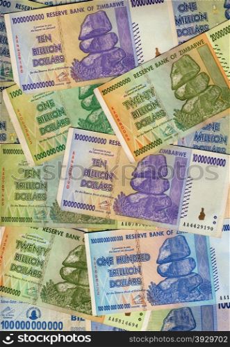 Banknotes of Zimbabwe including a banknote of one hundred trillion dollars. This banknote has the highest nominal value in history