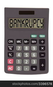 bankrupcy on display of an old calculator on white background