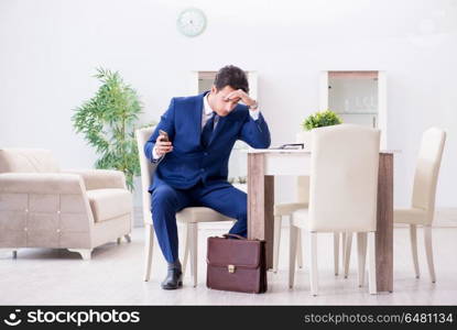 Bankrupt businessman angry and upset at home