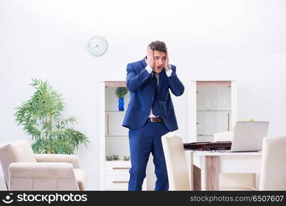 Bankrupt businessman angry and upset at home