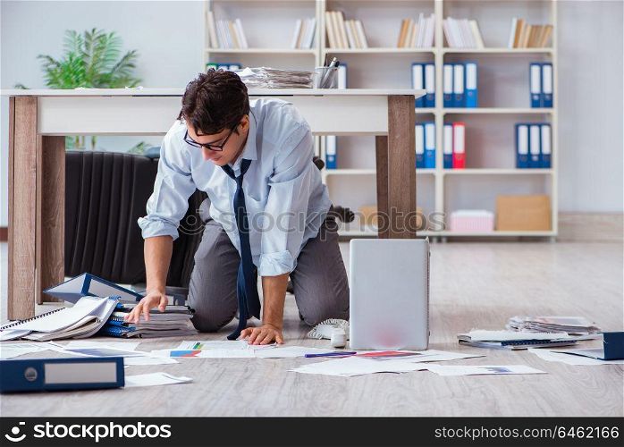 Bankrupt businessman angry in the office floor