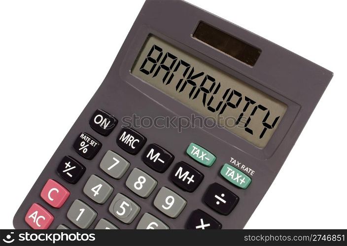 bankruptcy written on display of an old calculator on white background in perspective