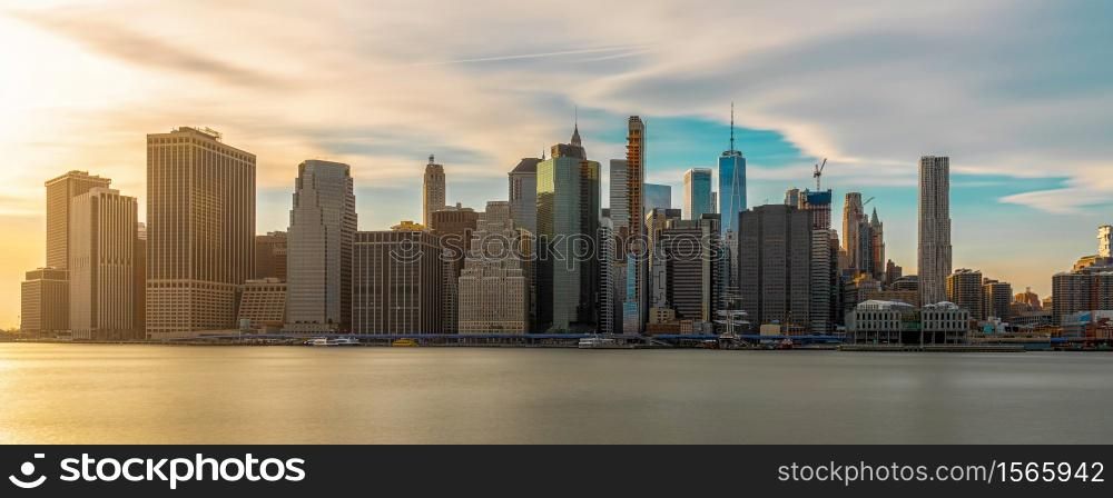 Banner and Panorama of New york Cityscape with Brooklyn Bridge over the east river at the evening time, USA downtown skyline, United states of America, Architecture and building with tourist concept
