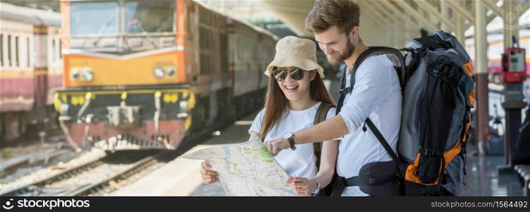 Banner and web page or cover template of Multiethnic Travelers are looking at the map at the train station, Travel and transportation concept