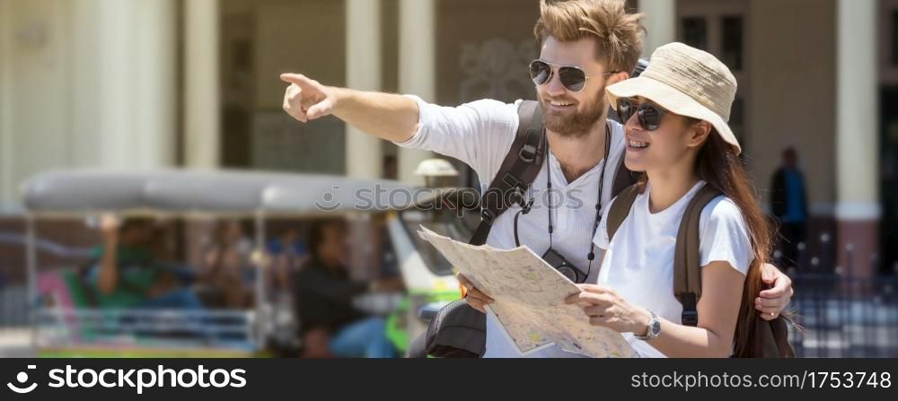 Banner and web page or cover template of Multiethnic Travellers are looking the destination and holding the map at the train station, Travel and transportation concept