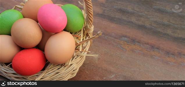 Banner background with copy space, Colorful Easter eggs on wooden background