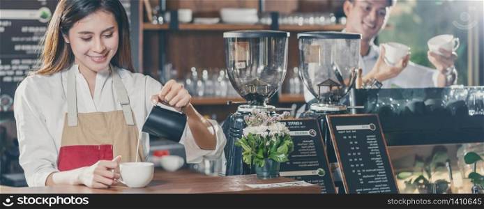 Banner of Asian Barista preparing cup of coffee, espresso with latte or cappuccino for customer order in coffee shop,bartender pouring milk,Small business owner and startup in coffee shop concept