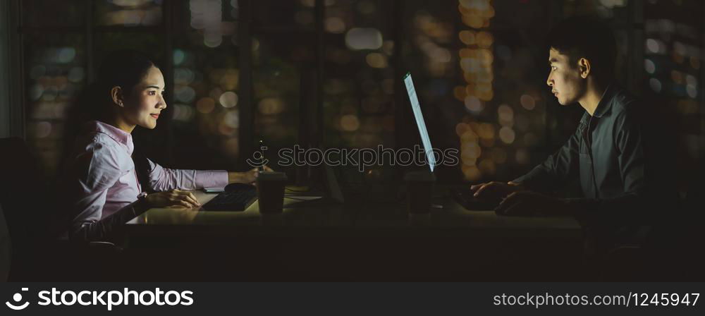 Banner of Asian business woman and business man working hard late together with technology computer in office,customer service and call center,team work with colleagues for success achievement concept