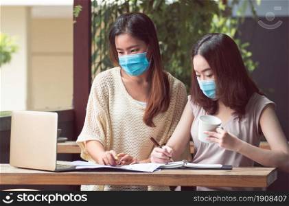 Banner of asian women wearing mask to protect virus and working from home. New Normal and Technology concept.