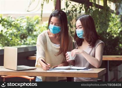 Banner of asian women wearing mask to protect virus and working from home. New Normal and Technology concept.