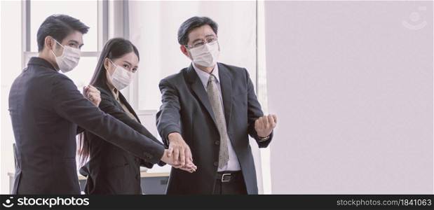 Banner of business people wearing mask and making hands to stop virus pandemic. There is a copy space on the right side.