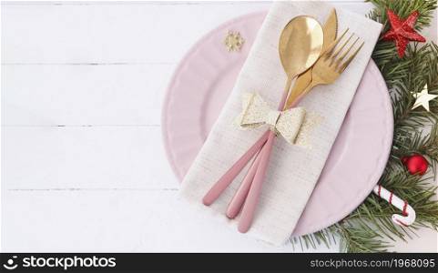 banner of Christmas table setting. pink plate, cutlery with gold bow, fir branches and stars. copy space.