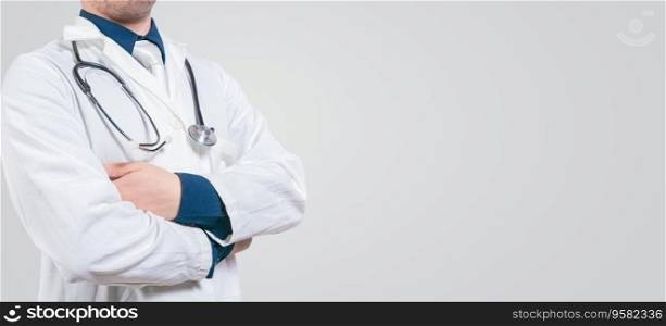 Banner of unrecognizable doctor with crossed arms with space for text. Crossed arms doctor medical banner
