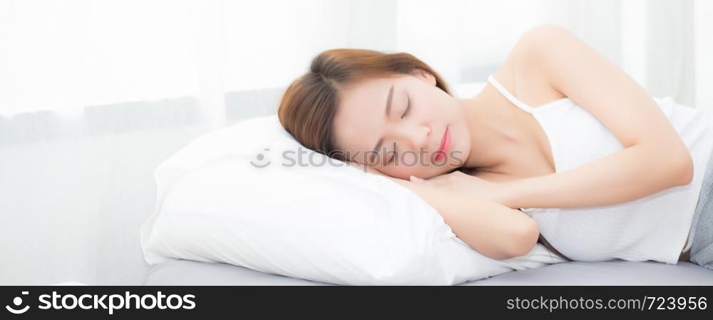Banner website beautiful asian young woman sleeping lying in bed with head on pillow comfortable and happy. girl with relax for health concept.