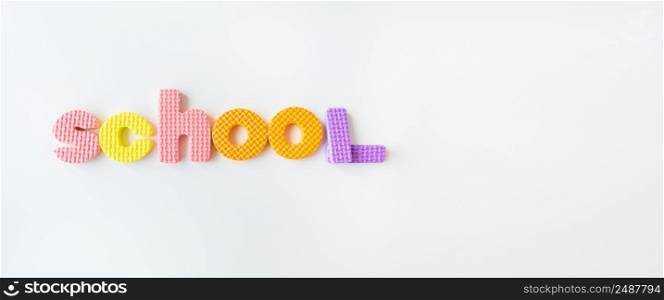 Banner with multi-colored letters. Letters for the study of children in kindergarten or school, fluted letters. School inscription. Banner with multi-colored letters. Letters for the study of children in kindergarten or school, fluted letters. School inscription.