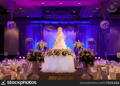Banquet Facilities include a dining table, wedding cake and the stage.