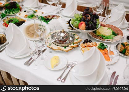 Banquet wedding table setting on evening reception awaiting guests. Banquet wedding table setting on evening reception