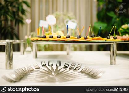 Banquet wedding table setting with fork and fruits. wedding table setting with fork and fruits