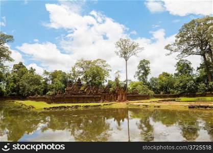 Banteay Srei Temple ancient ruins reflecting in water, Siem Reap, Cambodia.