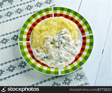 Banusz - traditional dish of Hutsuls.Carpathian highlanders.corn porridge made with bacon, mushrooms and cream sauce