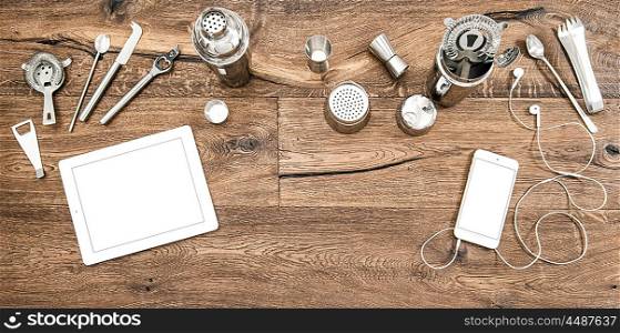 Bar counter with tools, accessories and electronic devices. Flat lay background