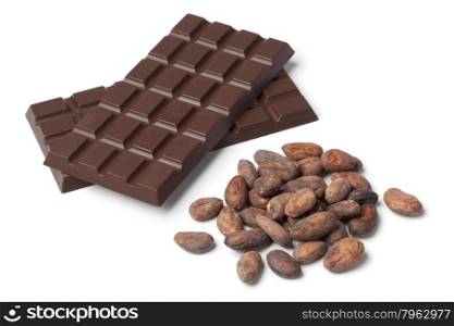 Bar of chocolat with cocoa beans on white background