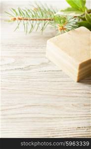 Bar of natural herbal handmade soap on a wooden background