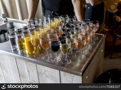 bar with glasses with red and white wine and longdrinks and other non alcohol and alcohol drinks