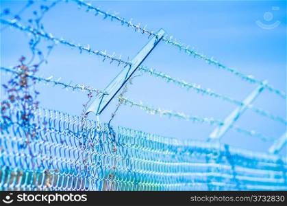 barb wire fence securing a perimeter
