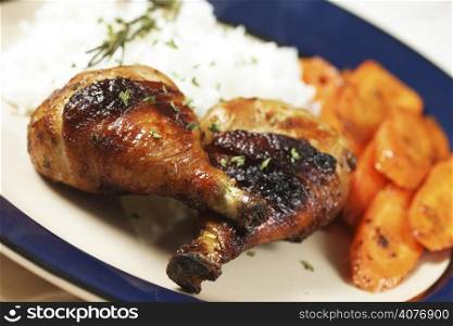 Barbecue chicken meal with carrots and rice