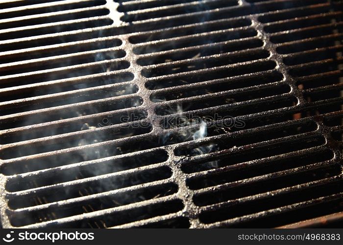 Barbecue grill texture with coal smoke macro detail